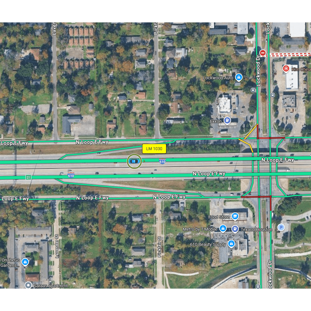 GPS Aerial view of a highway intersection with road signs and surrounding area